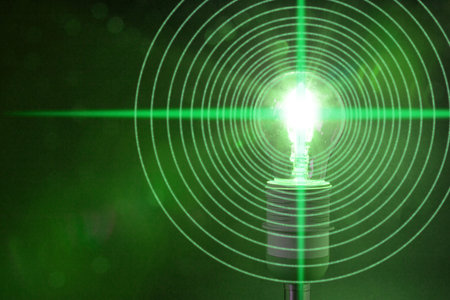 Glowing bulb is emitting circular datastreams of one and zero Lifi conceptの写真素材