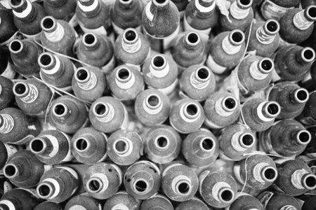 Empty dusty beer bottles in black and whiteの写真素材