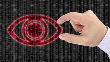 Hand holding an eye on top of a blurry grey digital matrix to uncover red datastreans data espionage...