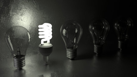 One energy saving glowing light bulb between old bulbs on black stone 3D illustration