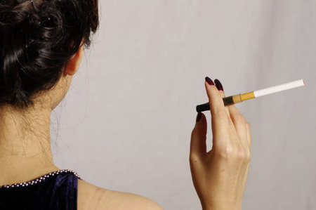 woman smokes in studio