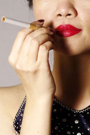 woman smokes in the studioの写真素材