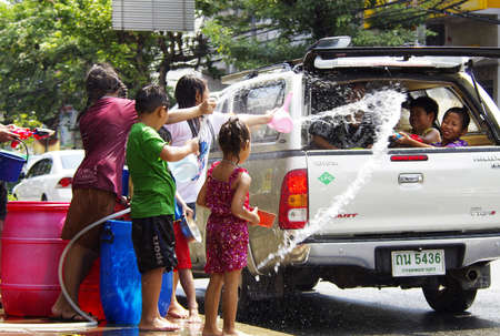 BANGKOK - APRIL 14 2012  Songkran  thai new year   water festival  is celebrated from april 13 to 15  people roam the streets and drench each other and passersby with waterのeditorial素材