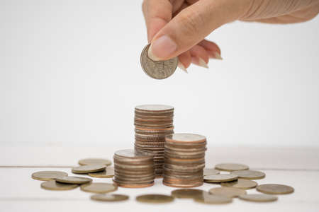 Hand and thai coin on the white background.の写真素材