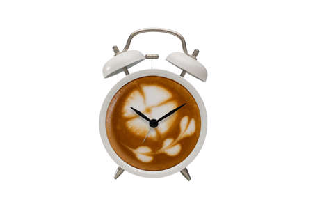 Hot coffee with frothy foam in white alarmclock design is Coffee Time Concept  on white backgroud.の写真素材