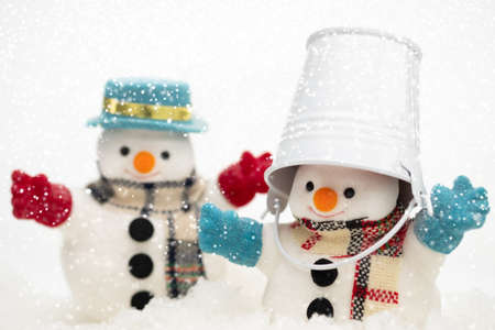 Snowman is standing in snowfall, Merry Christmas and happy New Year concept.の写真素材