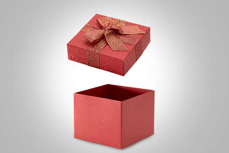 Open red gift box on gray background.の写真素材
