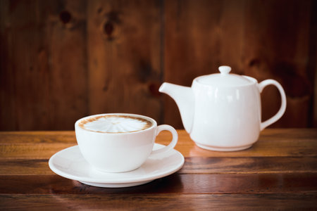 A cup of coffee on table in cafe.