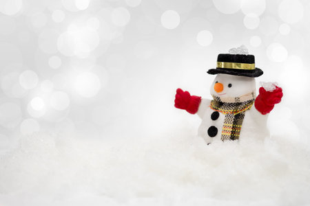 Snowman is standing in snowfall, Merry Christmas and happy New Year concept.