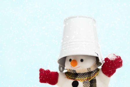 Snowman is standing in snowfall, Merry Christmas and happy New Year concept.の写真素材
