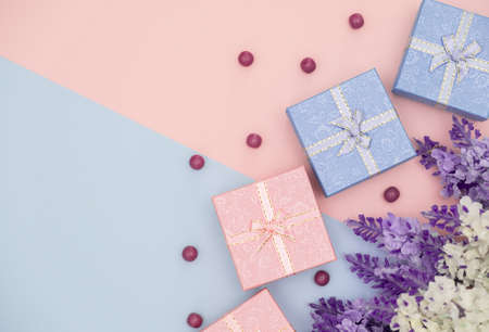 Blue and Pink Gift Box on Two Tone with flower.の写真素材