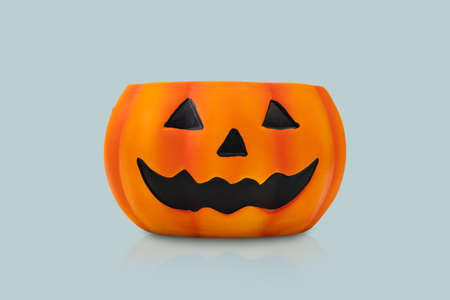 Halloween pumpkin on blue background. Halloween idea concept.の写真素材