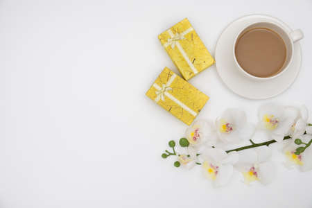 Top view Gift box and a cup of coffee on white background.の写真素材