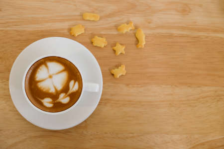 Top view, Cup of coffee on wooden table.の写真素材