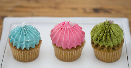 Tasty cupcakes Homemade  muffin  with cream buttercream for birthday, valentine, and christmas holliday.の写真素材