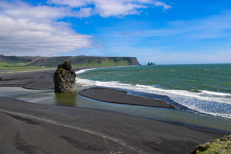 The impressive black sand beach of Dyrholaey in Southern Icelandの写真素材