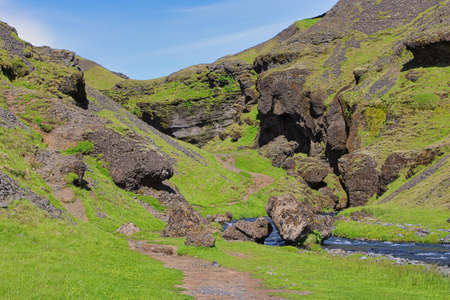 A beautiful unreal landscape around Kvernufoss waterfall in South Iceland, close to the village of Skogarの写真素材