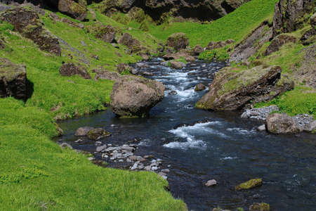 A beautiful unreal landscape around Kvernufoss waterfall in South Iceland, close to the village of Skogarの写真素材