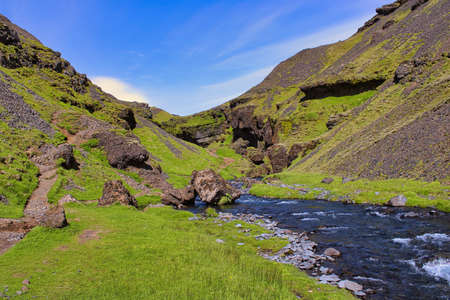 A beautiful unreal landscape around Kvernufoss waterfall in South Iceland, close to the village of Skogarの写真素材