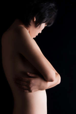Female nude on a black background の写真素材
