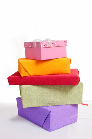stack of red gift boxes decorated with bow isolated on white