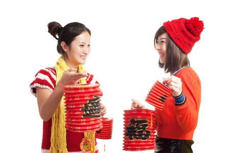 Two girls with lanterns to celebrate the Chinese traditional festival の写真素材