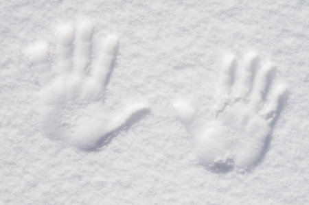 The palm of your hand is imprinted in the snow.