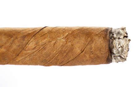 Burning cuban cigar isolated on a white backgroundの写真素材