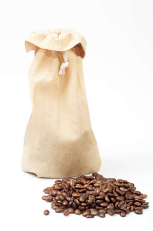 Coffee beans and hessian bags isolated on white backgroundの写真素材