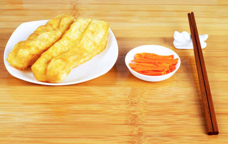 Fried bread stick and pickled vegetables, the Chinese breakfastの写真素材
