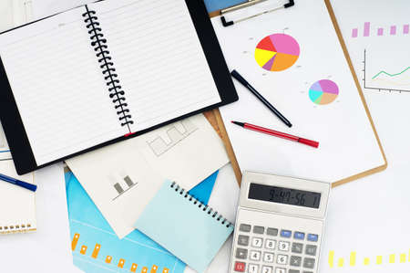 Chart with pen and calculatorの写真素材