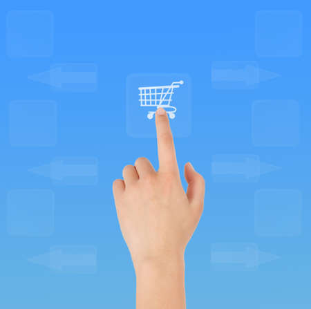 Woman's hand click on the shopping cartの写真素材