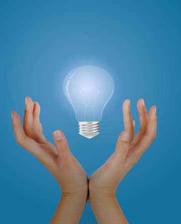 Hands to push the bulb の写真素材