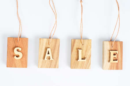 Sales wood sign isolated on white backgroundの写真素材