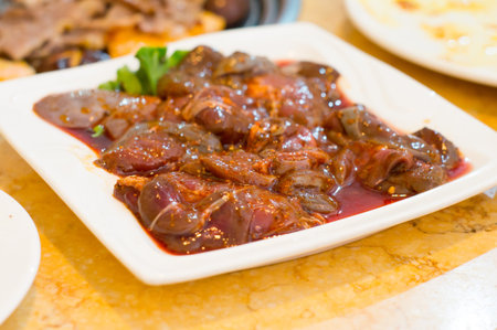 A tray of fresh, raw lambs' kidneys.. Shallow dof.の写真素材