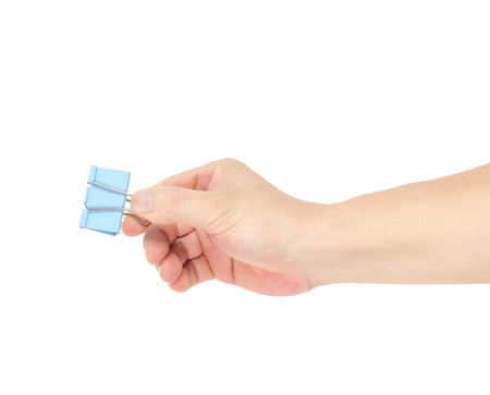 clothes pin in hand, isolated on white backgroundの写真素材