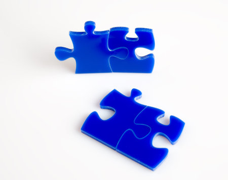 Blue Jigsaw puzzles blocks isolated on a white background.
