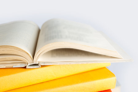 Composition with open books on white background