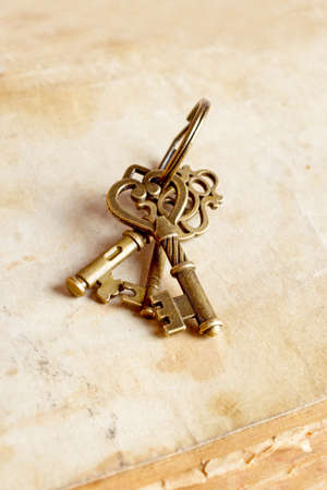 Photo of vintage keys with on textured backgroundの写真素材