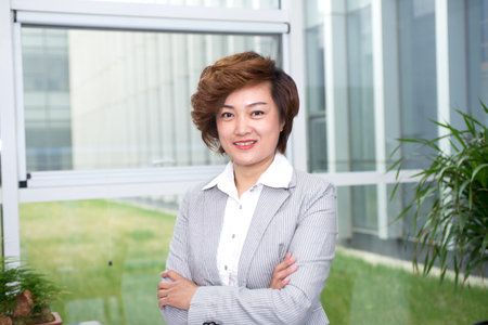 Image of pretty businesswoman looking at camera