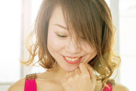 soft focus backlight picture of beautiful womanの写真素材
