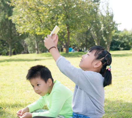 A Girl and A Boy With Tablet Computerの写真素材