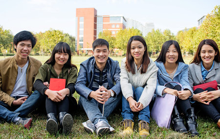 group of happy teen high school students outdoorsの写真素材