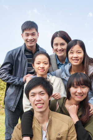 group of happy teen high school students outdoors