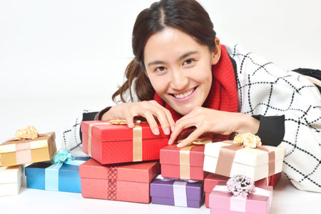 Asian woman with  presents  isolated on a white backgroundの写真素材