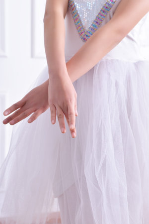 Half-length portrait of dancing ballerina with hands up, Concept of elegant art and sportive hobbyの写真素材