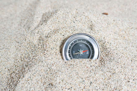 Closeup compass on the background of sandの写真素材