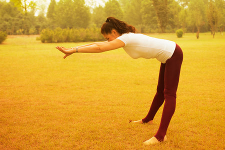 Elderly woman practicing yoga. At Park Lawn
