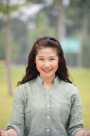 Portrait of senior woman meditating. In the Parkの写真素材