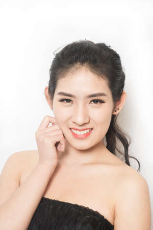 Closeup portrait of beautiful young woman with healthy clean skin on a faceの写真素材